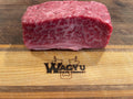 BMS 6-7 Australian Wagyu boneless short rib with exceptional marbling on Wagyu Steak Company cutting board