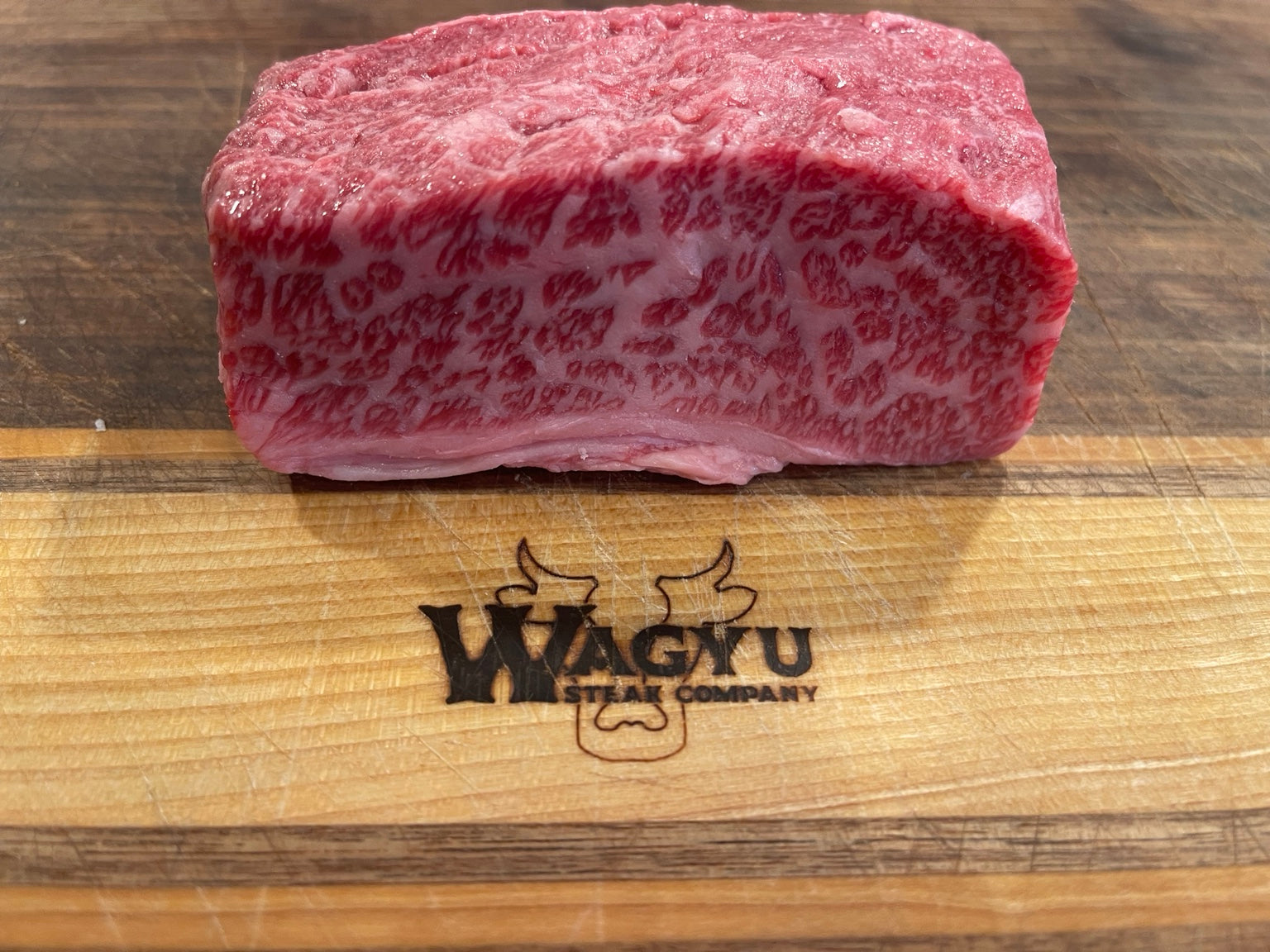 BMS 6-7 Australian Wagyu boneless short rib with exceptional marbling on Wagyu Steak Company cutting board
